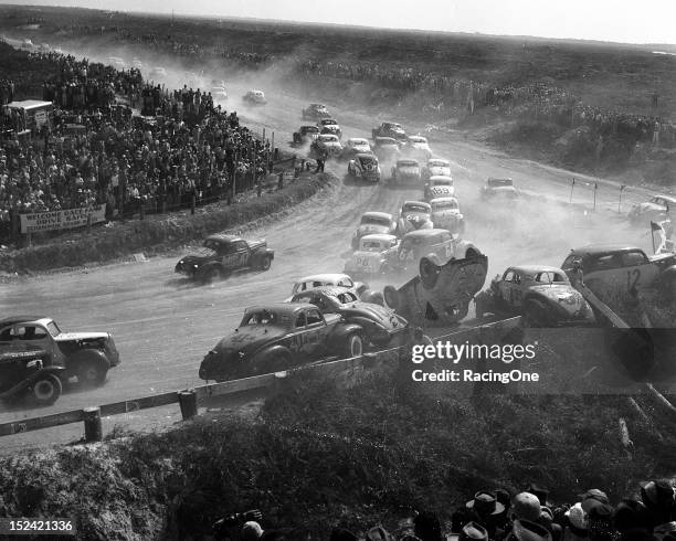 February 14, 1953: Things got very exciting exiting the North Turn of the Daytona Beach-Road Course during the NASCAR Modified race.