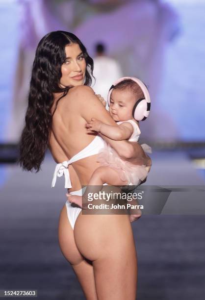 Nicole Williams English walks the runway during Sports Illustrated Swimsuit Show during Miami Swim Week at W Hotel Miami Beach on July 07, 2023 in...