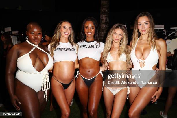 Achieng Agutu, Jena Sims, Brittney Mitchell, Berkleigh Wright and Penny Lane pose backstage for Sports Illustrated Swimsuit Runway Show at W Hotel...