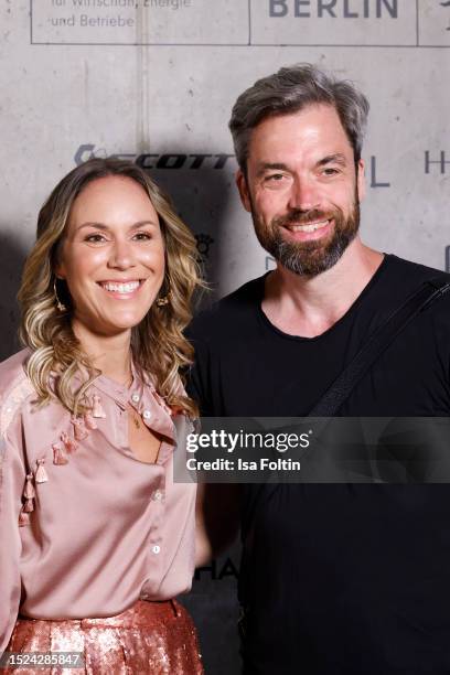 Sandra Kuhn and guest attend the Marcel Ostertag fashion show during the W.E4. Fashion Day as part of Berlin Fashion Week SS24 at Verti Music Hall on...