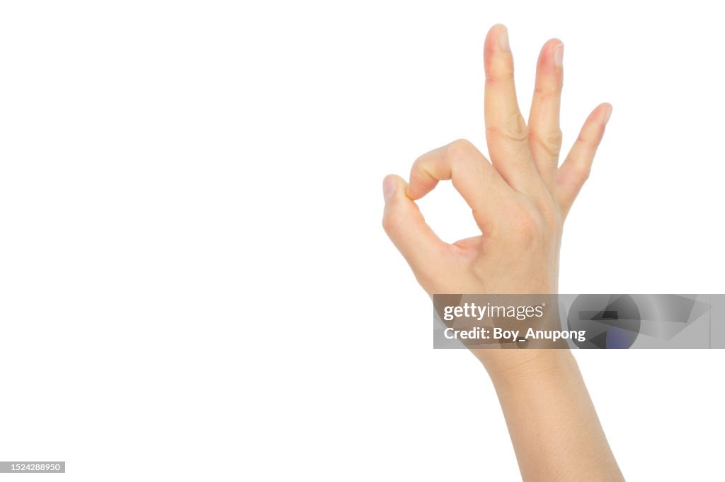 Cropped shot of someone hand showing OK gesture on isolated background. The "OK" hand gesture is now a hate symbol, according to a new report by the Anti-Defamation League.