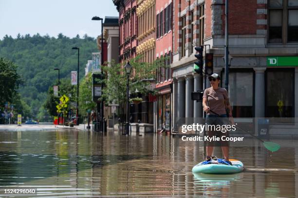 Montpelier resident Lynnea Timpone paddle boards at the intersection of Main Street and East State Street on July 11, 2023 in Montpelier, Vermont. Up...