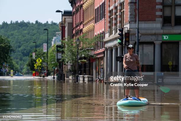 Montpelier resident Lynnea Timpone paddle boards at the intersection of Main Street and East State Street on July 11, 2023 in Montpelier, Vermont. Up...
