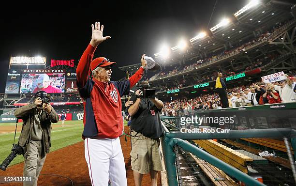 Manager Davey Johnson of the Washington Nationals waves to the crowd after the Nationals beat the Los Angeles Dodgers 4-1 to clinch a playoff spot at...