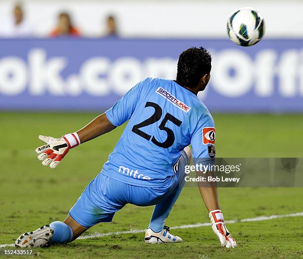 Daniel Arroyo of the C.D. FAS watches a shot by Calen Carr of the Houston Dynamo for a goal at BBVA Compass Stadium on September 20, 2012 in Houston,...