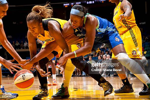 September 20: Kia Vaughn of the New York Liberty reaches for a loose ball against Amber Holt of the Tulsa Shock during the WNBA game on September 20,...