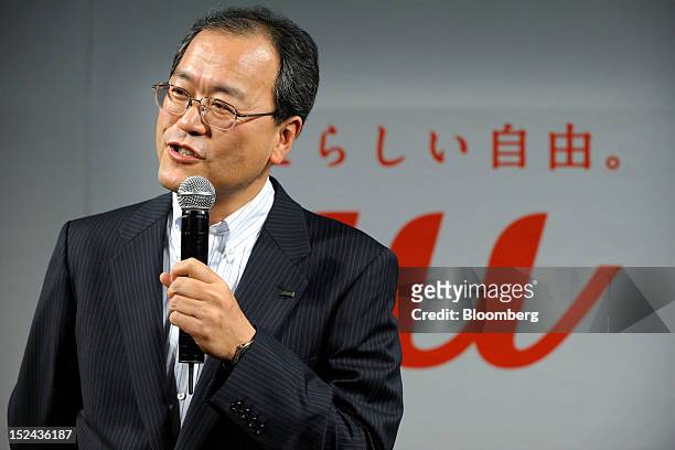 Takashi Tanaka, president of KDDI Corp., speaks during a launch event for the Apple Inc. IPhone 5 in Tokyo, Japan, on Friday, September. 21, 2012....