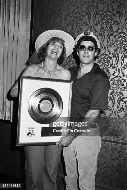 28th AUGUST: Toni Tennille and 'Captain' Daryl Dragon from American pop duo Captain & Tennille posed holding a gold disc in New Haven, Connecticut on...