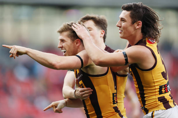Dylan Moore of the Hawks celebrates kicking a goal during the round 17 AFL match between Greater Western Sydney Giants and Hawthorn Hawks at GIANTS...