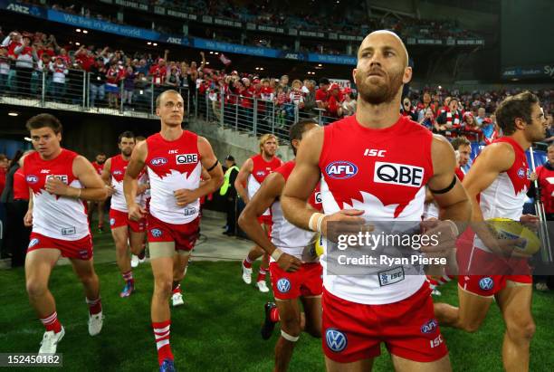 Jarrad McVeigh of the Swans leads his team out before the second AFL Preliminary Final match between the Sydney Swans and the Collingwood Magpies at...