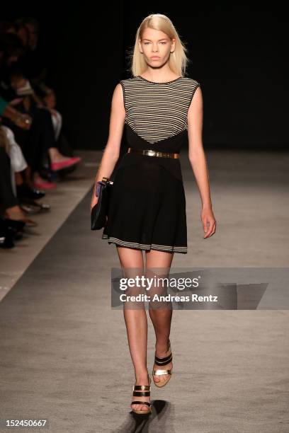 Model walks the runway at the Les Copains Spring/Summer 2013 fashion show as part of Milan Womenswear Fashion Week on September 21, 2012 in Milan,...