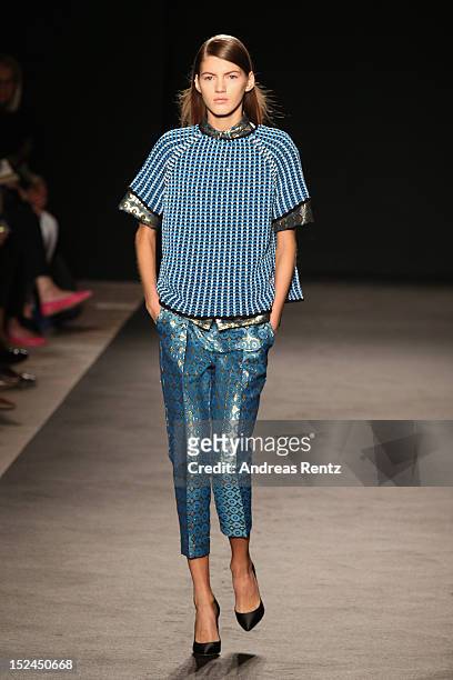 Model walks the runway at the Les Copains Spring/Summer 2013 fashion show as part of Milan Womenswear Fashion Week on September 21, 2012 in Milan,...