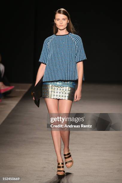 Model walks the runway at the Les Copains Spring/Summer 2013 fashion show as part of Milan Womenswear Fashion Week on September 21, 2012 in Milan,...