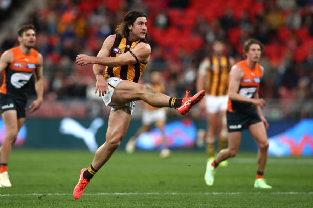 Jai Newcombe of the Hawks kicks during the round 17 AFL match between Greater Western Sydney Giants and Hawthorn Hawks at GIANTS Stadium on July 08,...