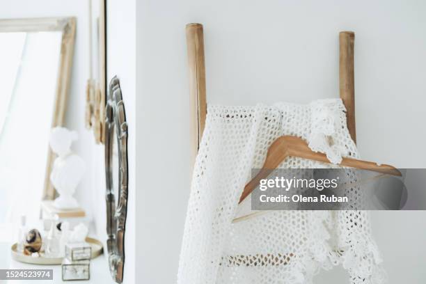 shawl, wooden hanger on a ladder, tall mirror, frames and decor. - shabby chic stockfoto's en -beelden