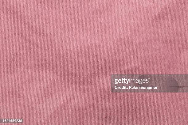 pink color fabric cloth polyester texture and textile background. - pink jersey stock-fotos und bilder