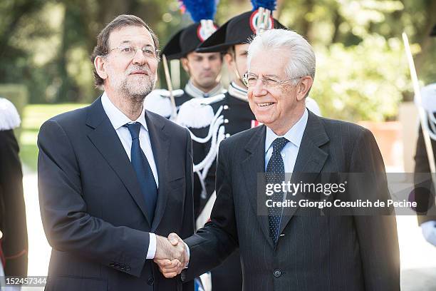 Spanish Prime Minister Mariano Rajoy shakes hands with Italian Prime Minister Mario Monti before a meeting at Villa Doria Pamphilj on September 21,...