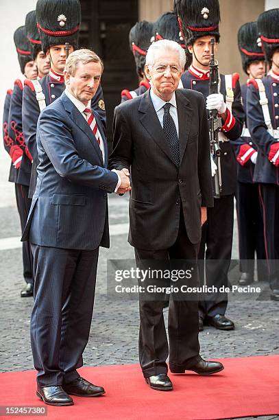 Irish Prime Minister Enda Kenny shakes hands with Italian Prime Minister Mario Monti before a meeting at Palazzo Chigi on September 21, 2012 in Rome,...