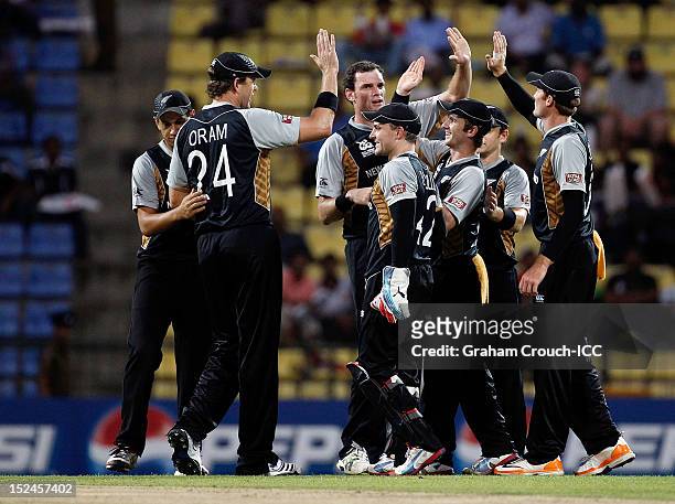 New Zealand celebrate the wicket of Shakib Al Hasan of Bangladesh during the ICC World T20 Group D match between New Zealand and Bangladesh at...
