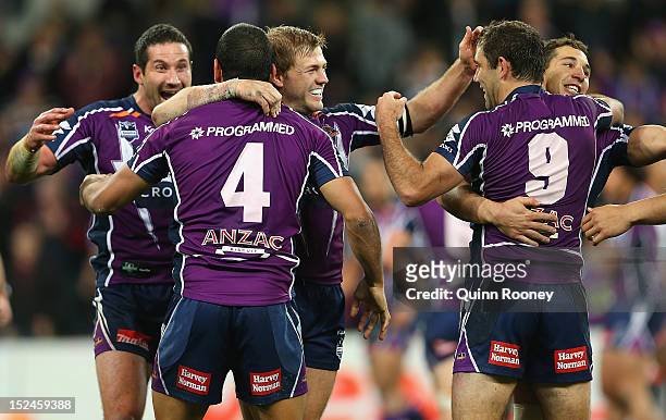 Melbourne Storm players celebrate winning the NRL Preliminary Final match between the Melbourne Storm and the Manly Sea Eagles at AAMI Park on...