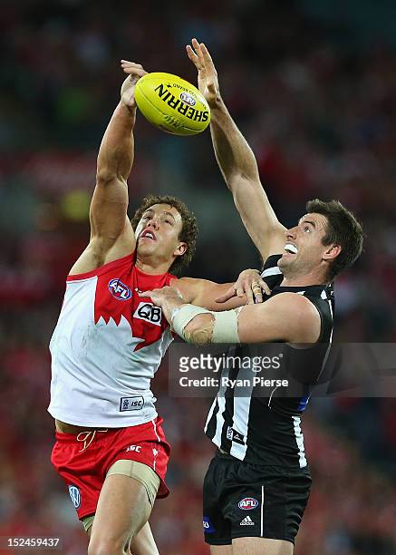 Shane Mumford of the Swans competes in the ruck against Darren Jolly of the Magpies during the second AFL Preliminary Final match between the Sydney...