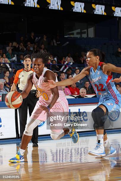 Epiphanny Prince of the Chicago Sky drives past Arminte Price of the Atlanta Dream on September 20, 2012 at the Allstate Arena in Rosemont, Illinois....