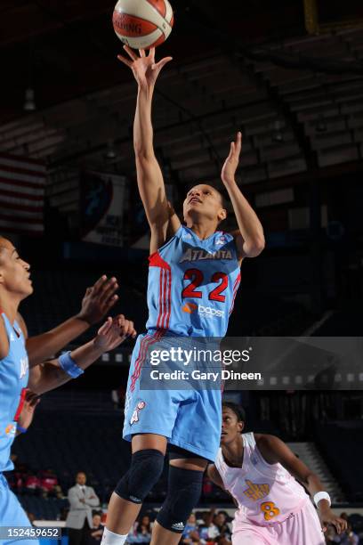 Arminte Price of the Atlanta Dream puts up a shot over Swin Cash of the Chicago Sky on September 20, 2012 at the Allstate Arena in Rosemont,...