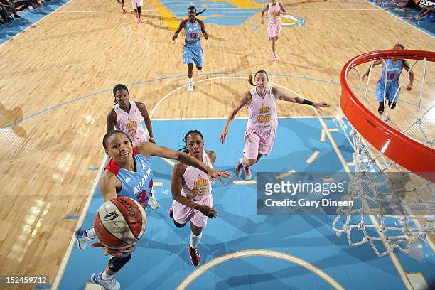 Arminte Price of the Atlanta Dream goes to the basket past Shay Murphy, Le'coe Willingham and Ruth Riley of the Chicago Sky on September 20, 2012 at...