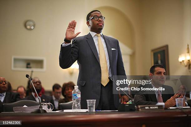 Mikael Moore, chief of staff for Rep. Maxine Waters and her grandson, is sworn in before testifying during a rare open hearing of the House Committee...