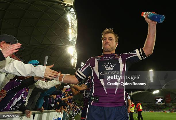 Ryan Hincliffe of the Storm high fives fans after winning the NRL Preliminary Final match between the Melbourne Storm and the Manly Sea Eagles at...