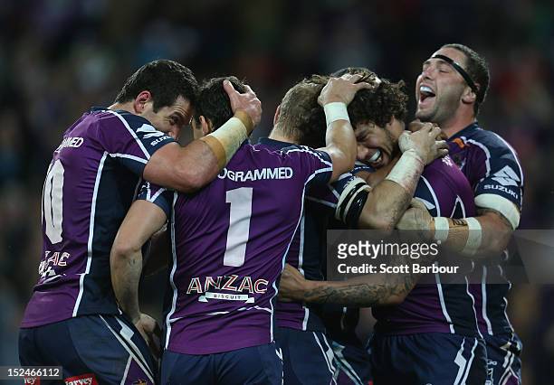 The Storm celebrate after Kevin Proctor of the Storm scored a try in the second half during the NRL Preliminary Final match between the Melbourne...