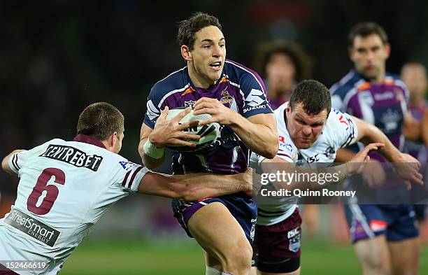 Billy Slater of the Storm is tackled by Kieran Foran of the Sea Eagles during the NRL Preliminary Final match between the Melbourne Storm and the...