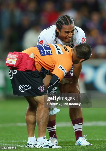 Steve Matai of the Sea Eagles is attended to by a trainer during the NRL Preliminary Final match between the Melbourne Storm and the Manly Sea Eagles...