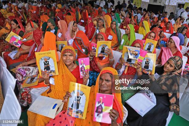 Women during the 'beneficiary communication meeting' where state government distributed funds to the beneficiaries under the 'Social Security Pension...