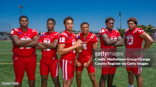 Mater Dei football players, from left, offensive lineman DeAndre Carter , outside linebacker/defensive end Nasir Wyatt , quarterback Elijah Brown ,...