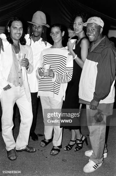 Jaye Davidson , Kimora Lee , Russell Simmons , and guests attend an event in Long Island, New York, on August 8, 1994.