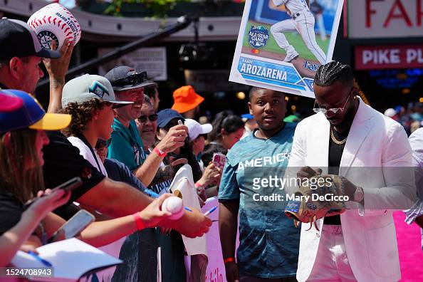 Randy Arozarena of the Tampa Bay Rays signs autographs during the