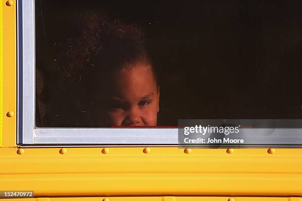 Ariana, age 4, arrives by bus to the federally-funded Head Start school on September 20, 2012 in Woodbourne, New York. The school provides early...