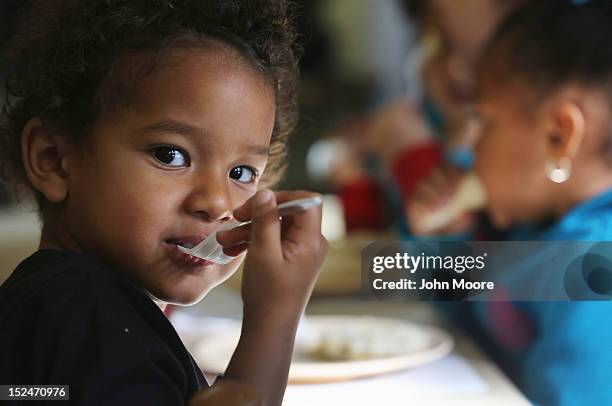 Jiovani eats breakfast at the federally-funded Head Start Program school on September 20, 2012 in Woodbourne, New York. The school provides early...