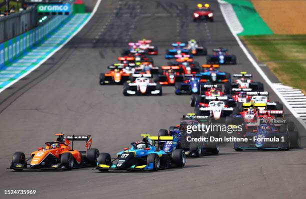 Jonny Edgar of Great Britain and MP Motorsport and Taylor Barnard of Great Britain and Jenzer Motorsport battle for track position at the start...