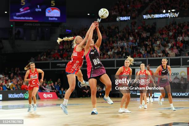 Tayla Fraser of the Swifts competes for the ball against Georgie Horjus of the Thunderbirds during the 2023 Super Netball Grand Final match between...