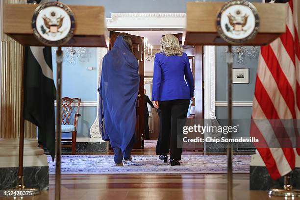 Pakistan Minister of Foreign Affairs Hina Rabbani Khar and U.S. Secretary of State Hillary Clinton walk away after making brief statements in the...