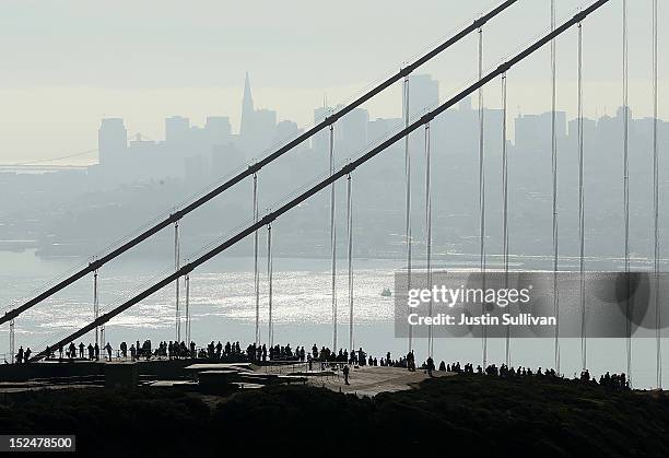 Spectators line a hilltop as they wait to see the Space Shuttle Endavour as it passes by en route to Los Angeles on September 21, 2012 in Sausalito,...