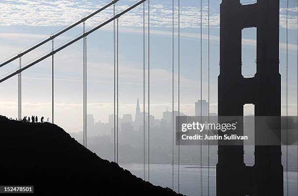 Spectators line a hilltop as they wait to see the Space Shuttle Endavour as it passes by en route to Los Angeles on September 21, 2012 in Sausalito,...