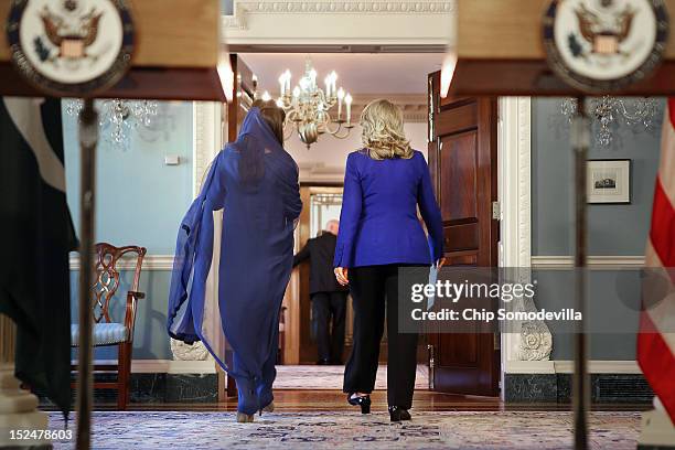 Pakistan Minister of Foreign Affairs Hina Rabbani Khar and U.S. Secretary of State Hillary Clinton walk away after making brief statements in the...