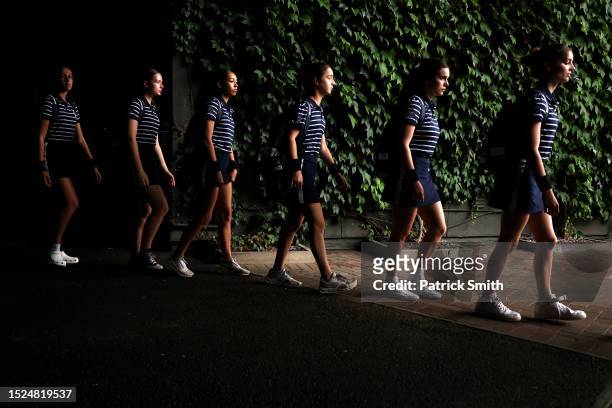 Ball girls and ball boys are make their way to the courts during day six of The Championships Wimbledon 2023 at All England Lawn Tennis and Croquet...