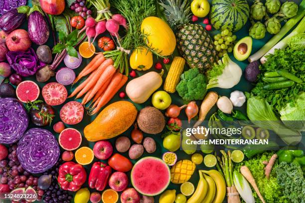 colorful raw fruits and vegetables varied vegan food, vivid rainbow arrangement - vegetal imagens e fotografias de stock