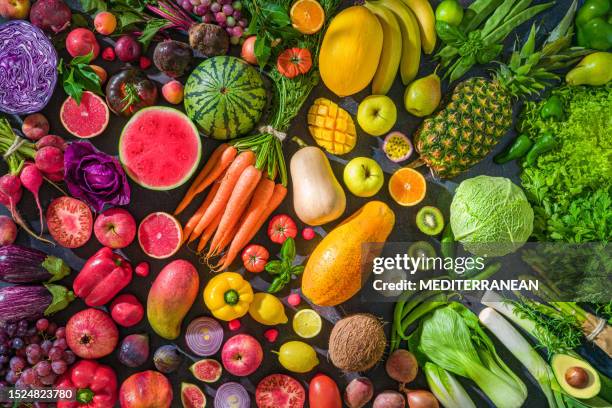 colorful raw fruits and vegetables varied vegan food, vivid rainbow arrangement - orange apple lemon stock pictures, royalty-free photos & images