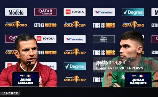 Mexico's interim coach Jaime Lozano speaks flanked by Mexico's defender Johan Vasquez during a press conference at Allegiant Stadium in Las Vegas,...