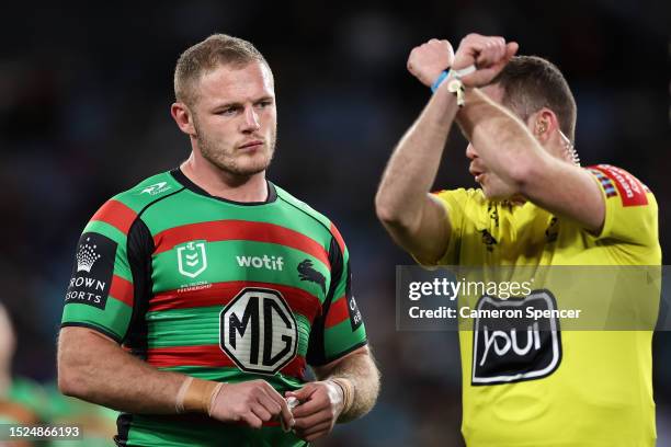 Referee Liam Kennedy talks to Tom Burgess of the Rabbitohs during the round 19 NRL match between South Sydney Rabbitohs and Canterbury Bulldogs at...